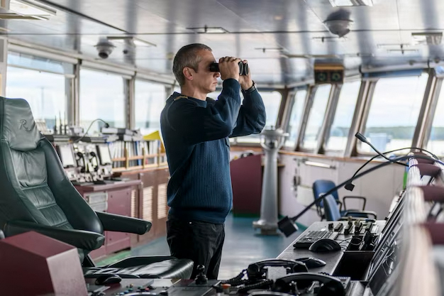 deck-officer-with-binoculars-navigational-bridge-seaman-board-vessel-commercial-shipping_160321-7814